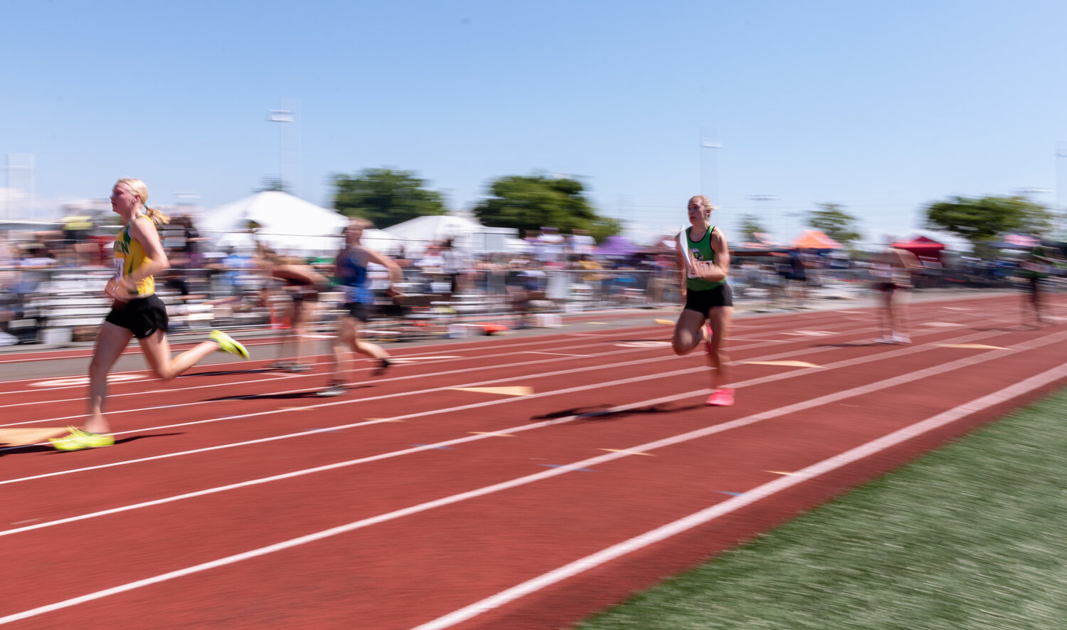 Tumwater’s Rhylee Beebe sprints in the second leg of the 2A girls 4x100 relay prelim at the WIAA 2A/3A/4A State Track and Field Championships on Friday, May 26, 2023, at Mount Tahoma High School in Tacoma. (Joshua Hart/For The Chronicle)